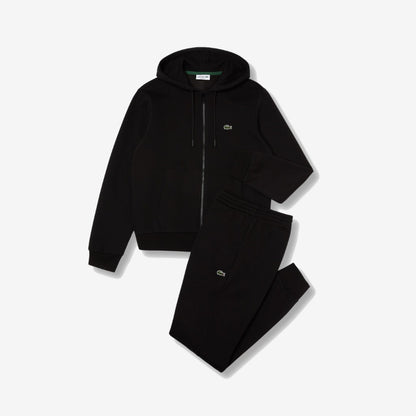 Ensemble Lacoste noir avec haut zippé à capuche, pantalon et détails crocodile verts