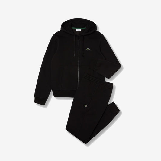 Ensemble Lacoste noir avec haut zippé à capuche, pantalon et détails crocodile verts