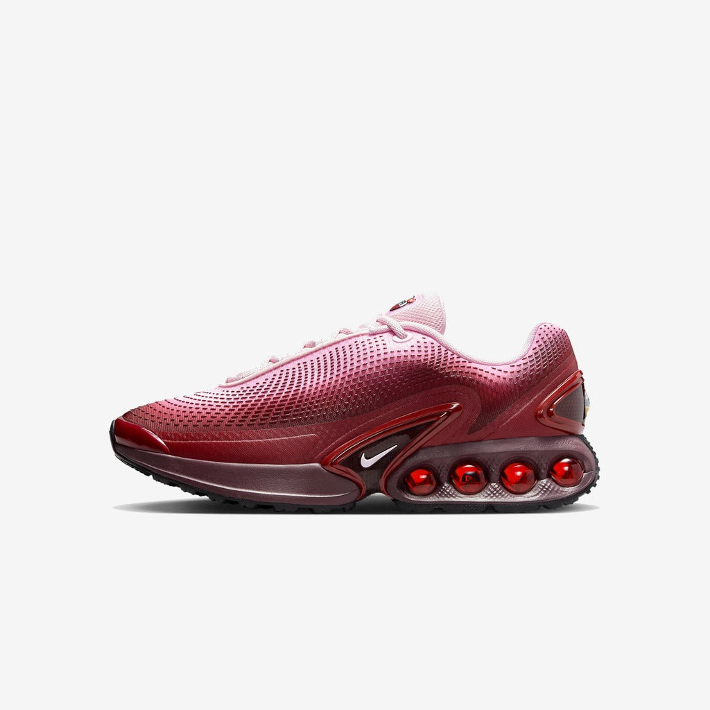 Nike Air Max DN rouge et rose à semelle sombre, vue de profil