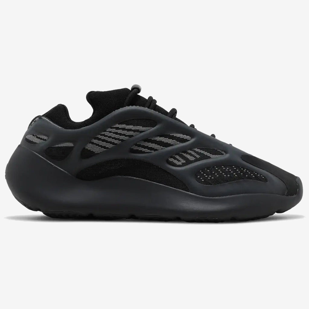 Yeezy 700 V3 noire, structure extérieure ajourée et bandes grises sur le côté